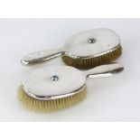 Pair of Liberty and Co turquoise inset silver hair brushes, Birmingham, 1906, 1910,
