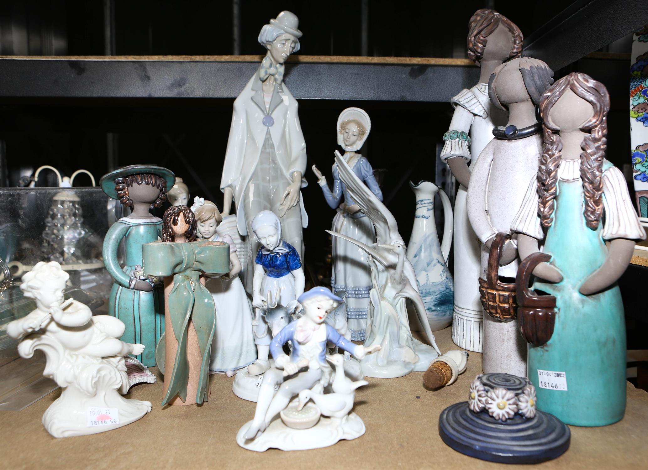 Twelve ceramic Figures including four Lladro, Models include large clown seated holding accordion. - Image 2 of 2