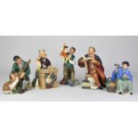 Five Royal Doulton figurines, HN 2253 "The Puppet Maker", HN 2281 "The Professor",