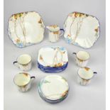 Shelly part tea set, to comprise eleven cups, twelve saucers, a slop bowl, two sandwich plates,