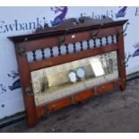 A mahogany framed hall mirror with fixings for ten coats/ hats. 101 cm wide x 61.5 cm high