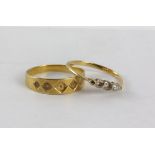 Two stamped 18ct rings, sizes N and M, 3.4 grams