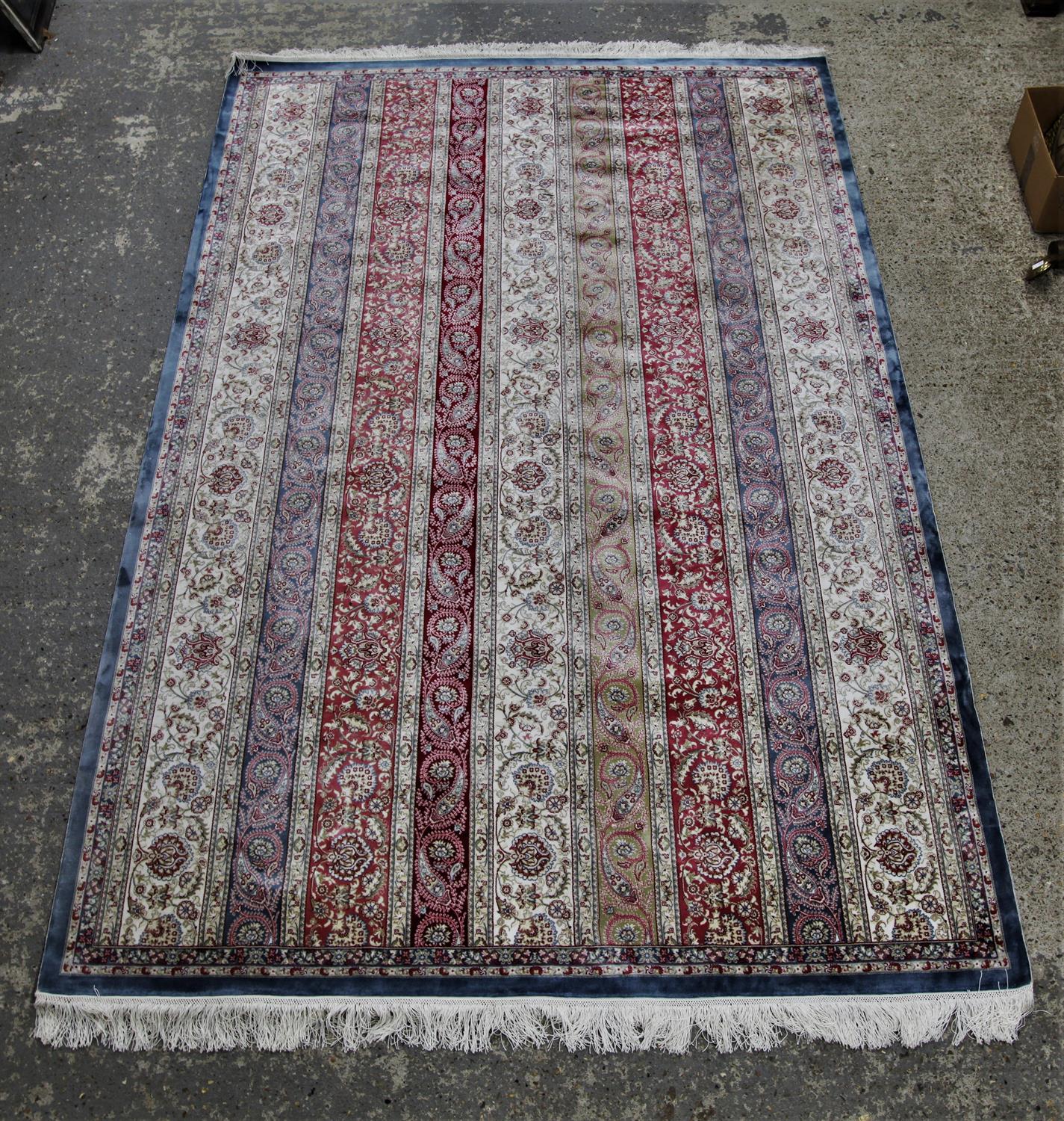 Persian design silk rug, with rows of trailing vine and boteh on ivory, blue, red and pistachio