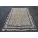 Indian carpet, with diagonal allover floral design on an ivory field with similar border,