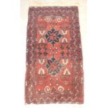 Tekke Turkman carpet, with eighteen geometric motifs, with octagonal motif border, on red ground,
