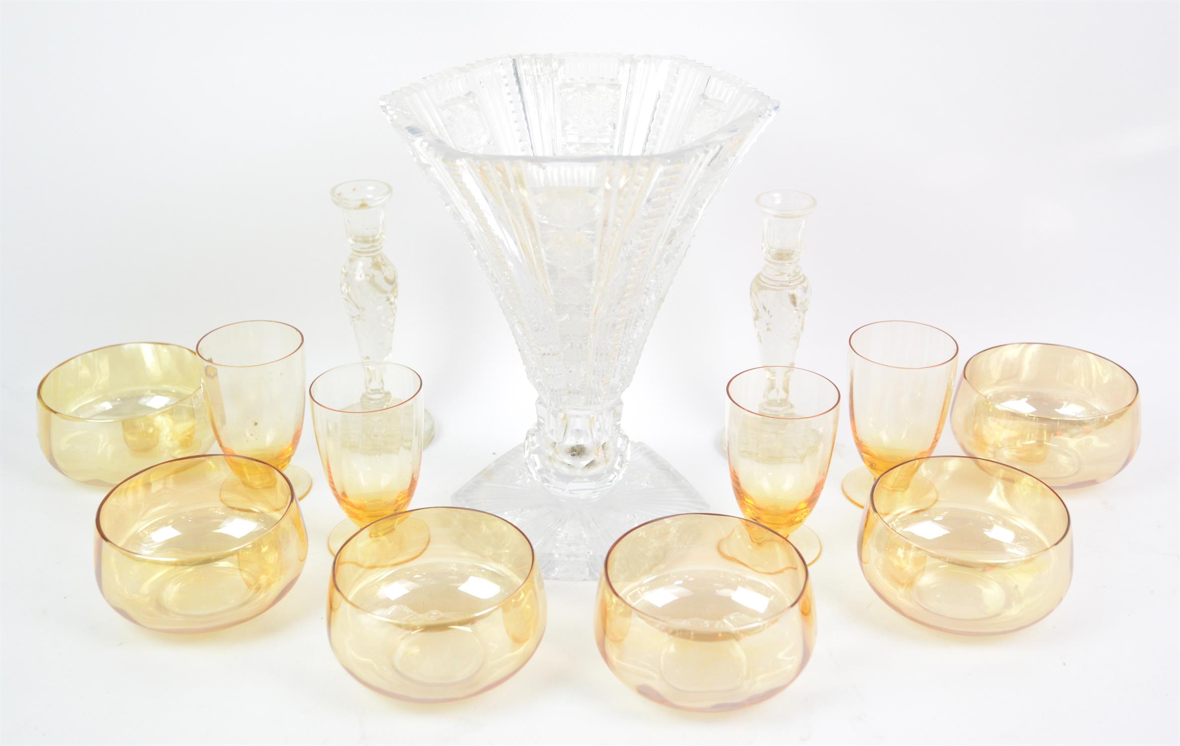 Glassware to include yellow glass bowls, clear glass candlesticks, dump weight, cut glass vase etc.