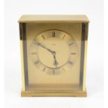 A brass "Mathew Norman" electric clock "Angelus", Roman numerals to brass chapter ring.