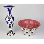 Bohemian pink glass overlaid bowl with painted decoration and a blue glass ovelaid vase with gilt