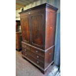 Georgian mahogany linen press, with dentil moulded top, above two panelled doors, lacking shelves,