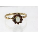 Garnet and paste ring floral cluster ring, set in hallmarked 9ct, ring size N, 1.9 grams