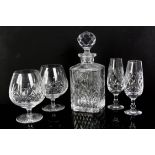 A large quantity of glassware including decanters, table lamp, shot glasses, tumblers,