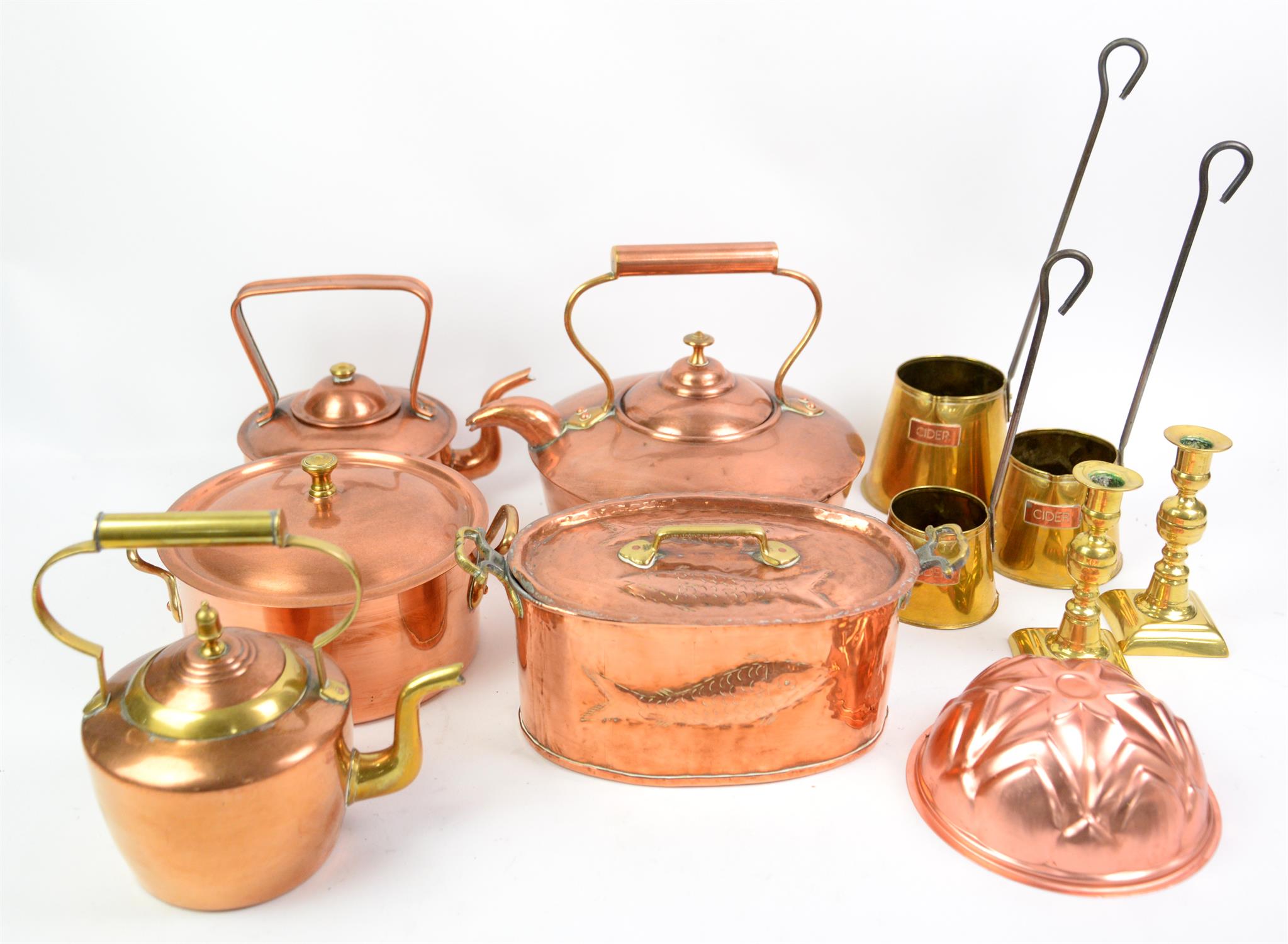 Brass and copperware, items include kettles, pans, candlesticks and bowls.