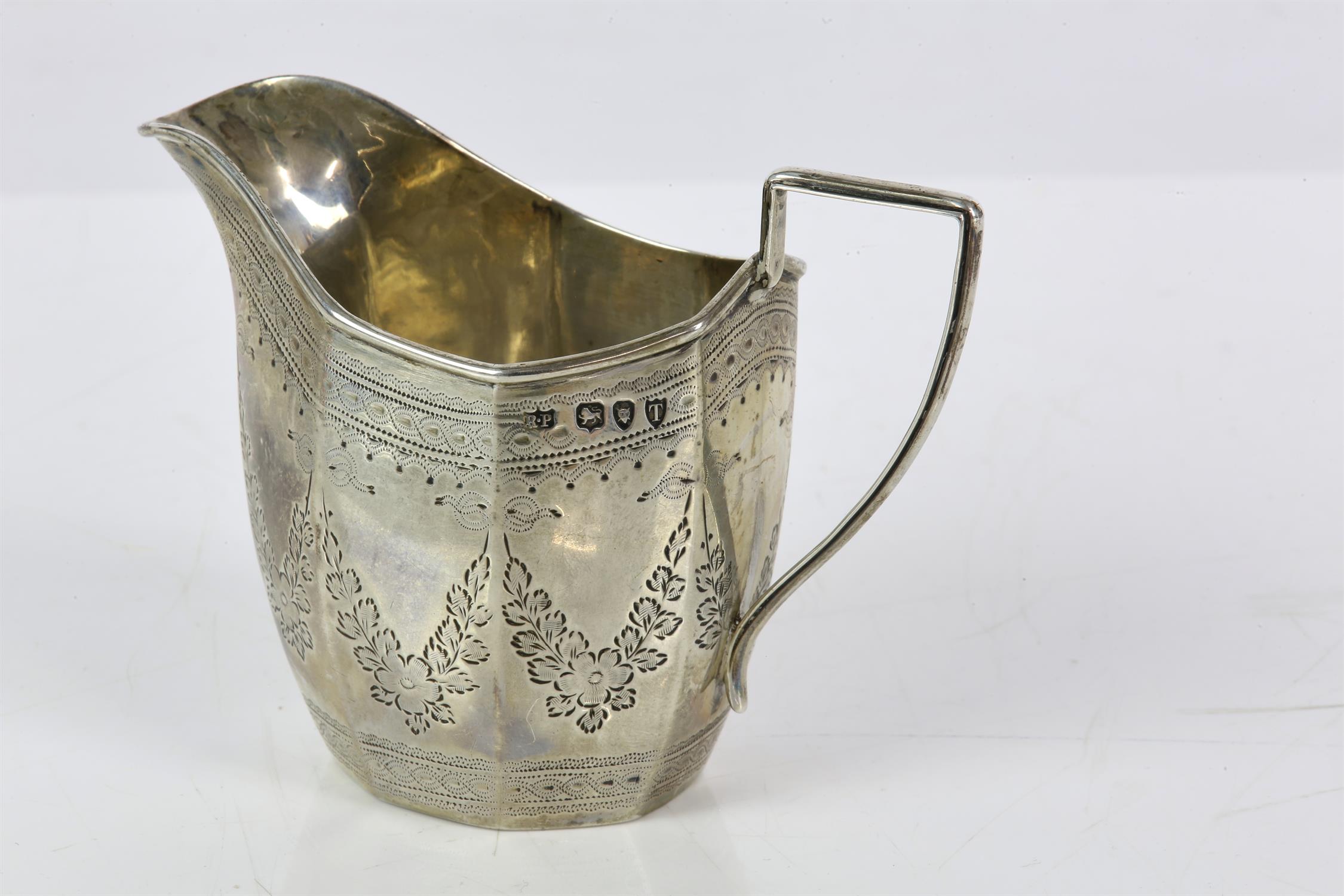Victorian octagonal panel silver cream or milk jug with bright cut floral decoration by Robert