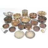 Large quantity of silver plated and white metal wine bottle coasters