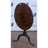 Circular mahogany tilt top table, 19th Century, on baluster stem, with tripod feet, 72cm high x 76.