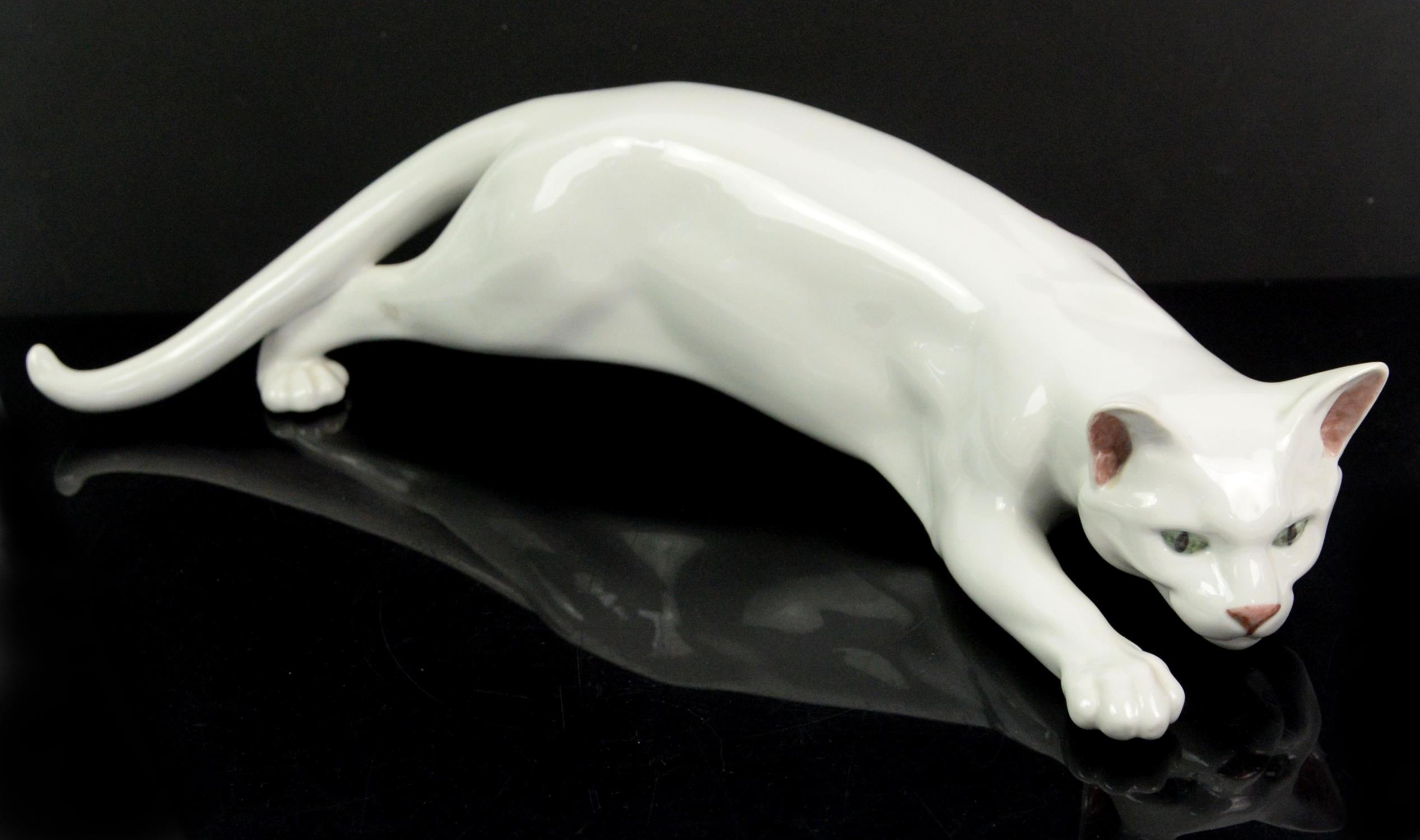 Large Royal Copenhagen porcelain cat, with a plain white glaze, numbered 059, 45cm L.
