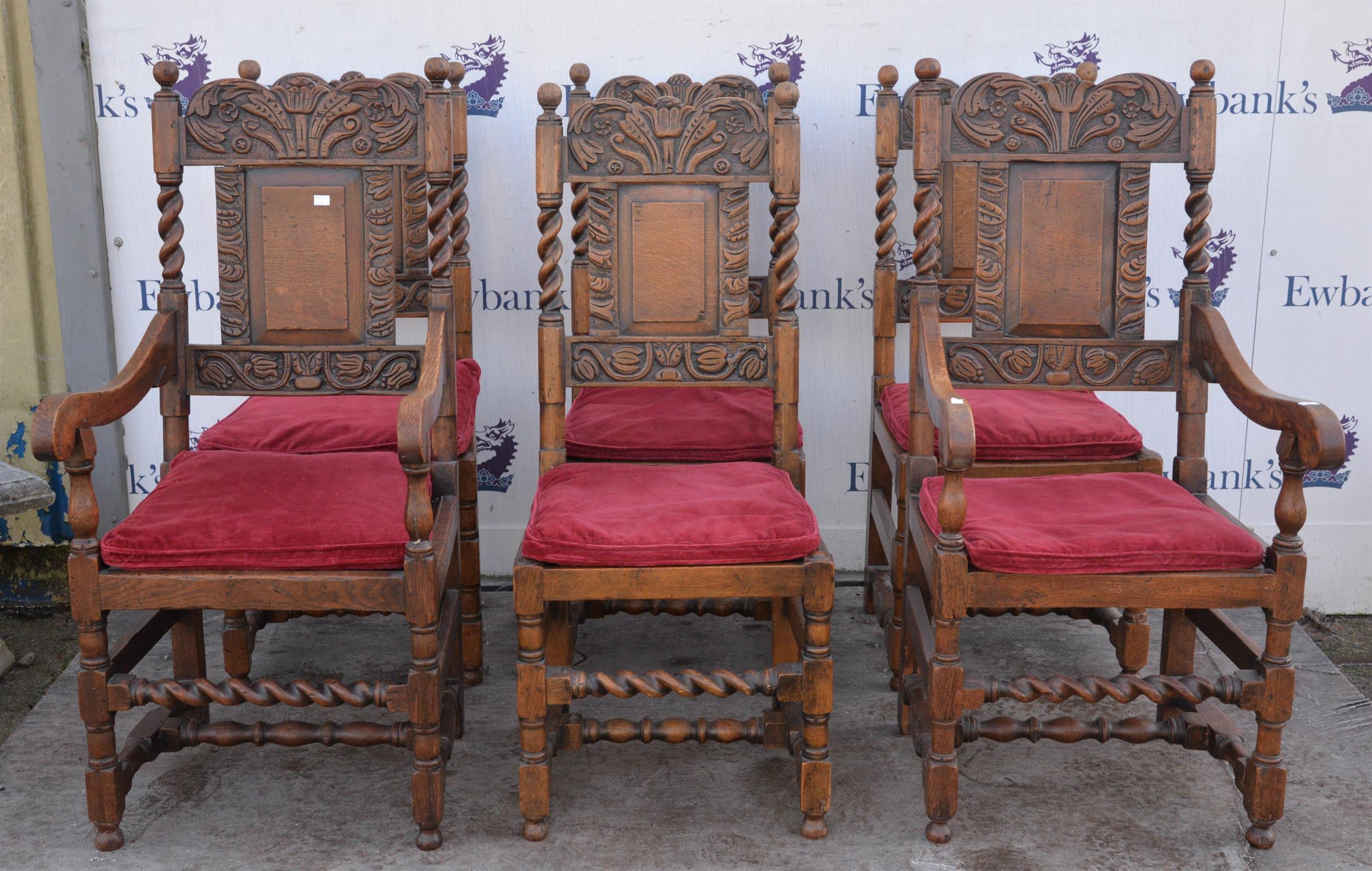 A set of six carved oak dining chairs, four plus two carvers. Foliate carved splats over solid seat