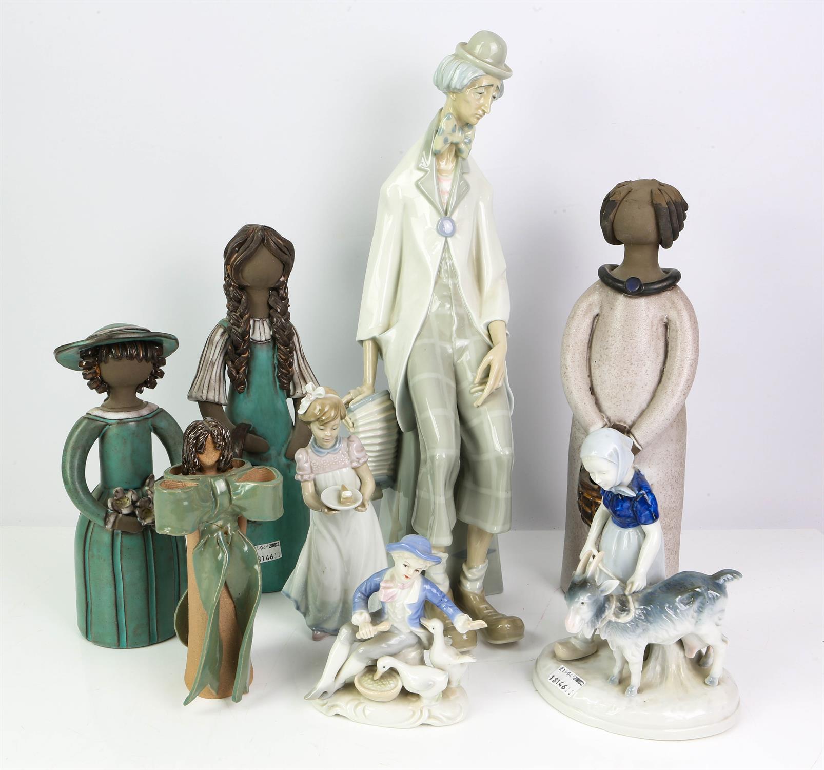 Twelve ceramic Figures including four Lladro, Models include large clown seated holding accordion.