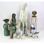 Twelve ceramic Figures including four Lladro, Models include large clown seated holding accordion.