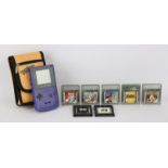 Nintendo Game Boy Color + 7 Games. This lot features a fully tested and working purple/grape Game