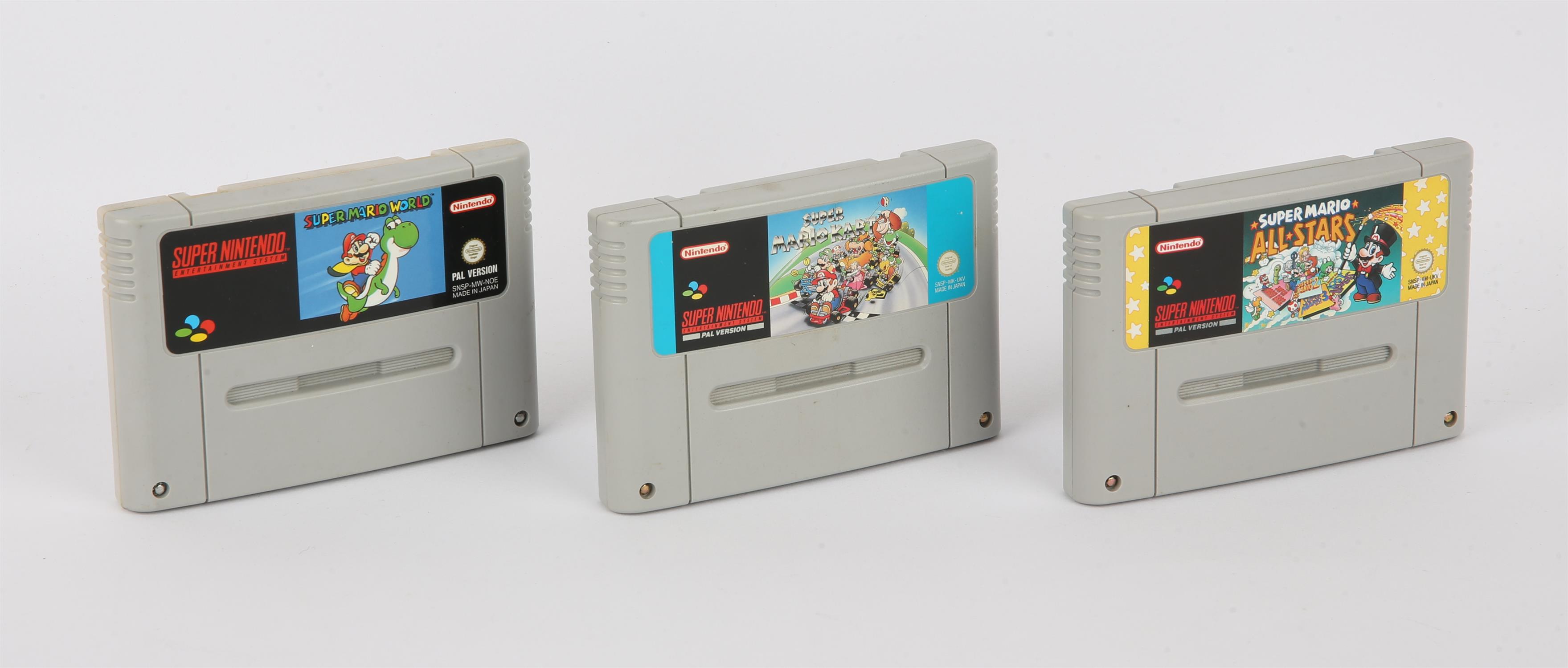 Super Nintendo SNES Mario Games Collection. This lot contains three loose cartridges,