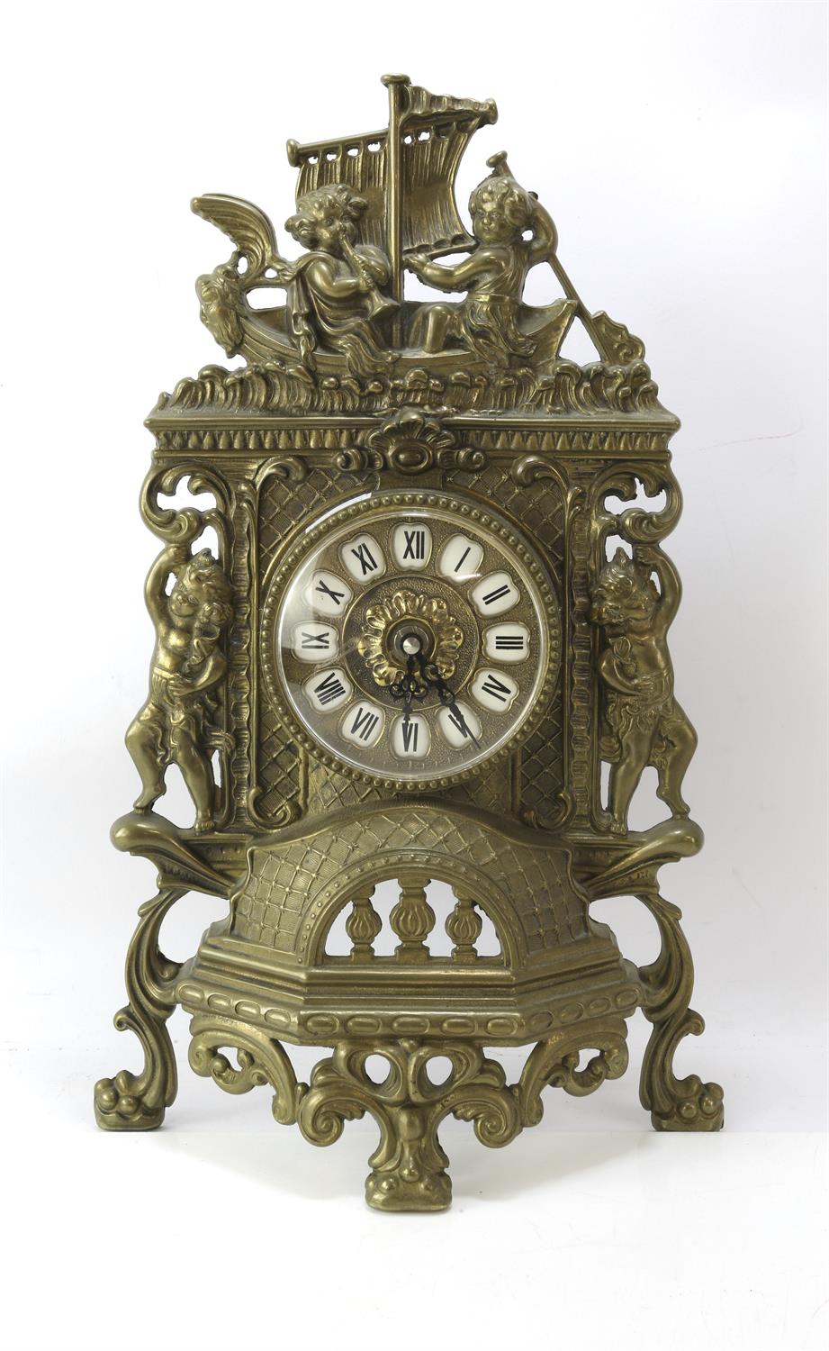 19th century brass clock mount with modern battery powered movement, with scrolling and putti