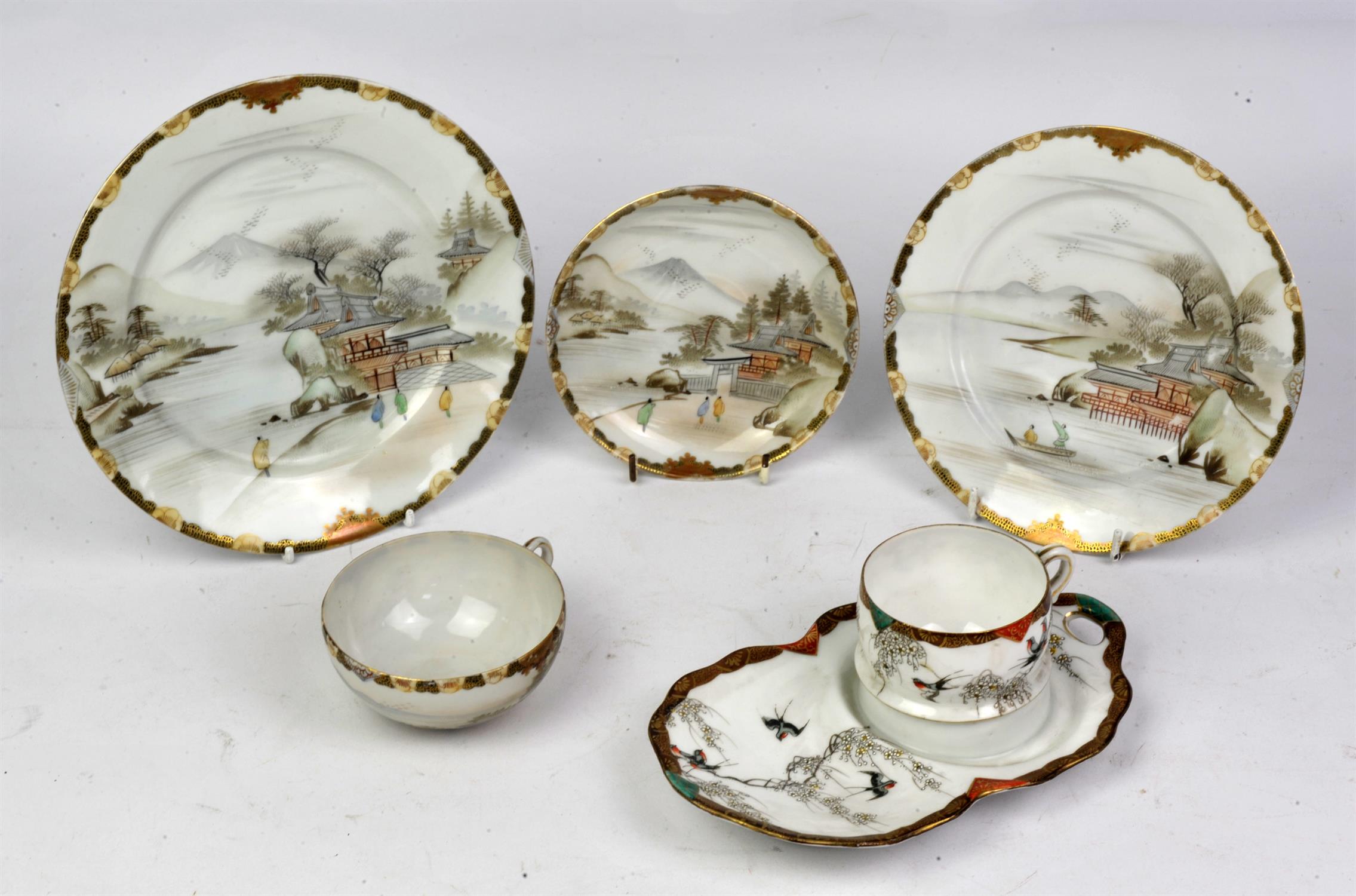 A Japanese early 20th Century tea service comprising of teapot tea cups, saucers,etc. Approx.