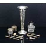Selection of silver items to include a spill vase, toothbrush and other pieces and a white metal