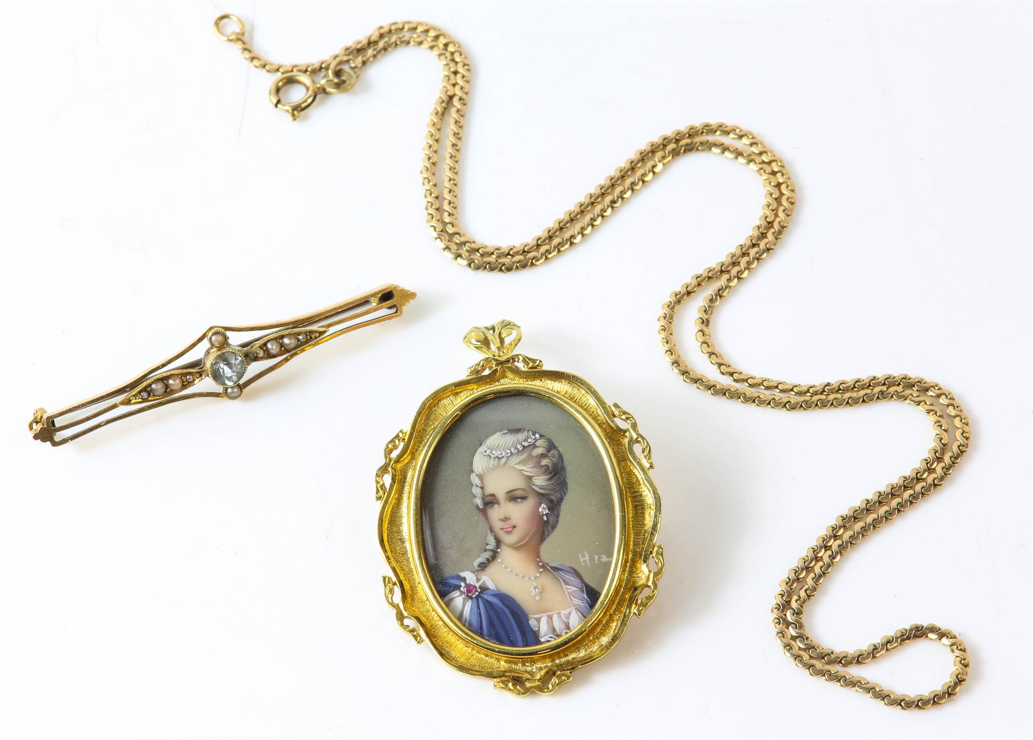 A stamped 18ct yellow gold brooch locket with an portrait of a woman wearing diamond jewellery,