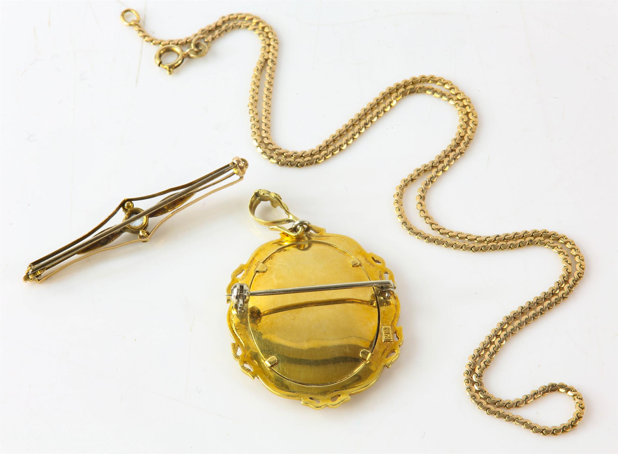 A stamped 18ct yellow gold brooch locket with an portrait of a woman wearing diamond jewellery, - Image 2 of 2