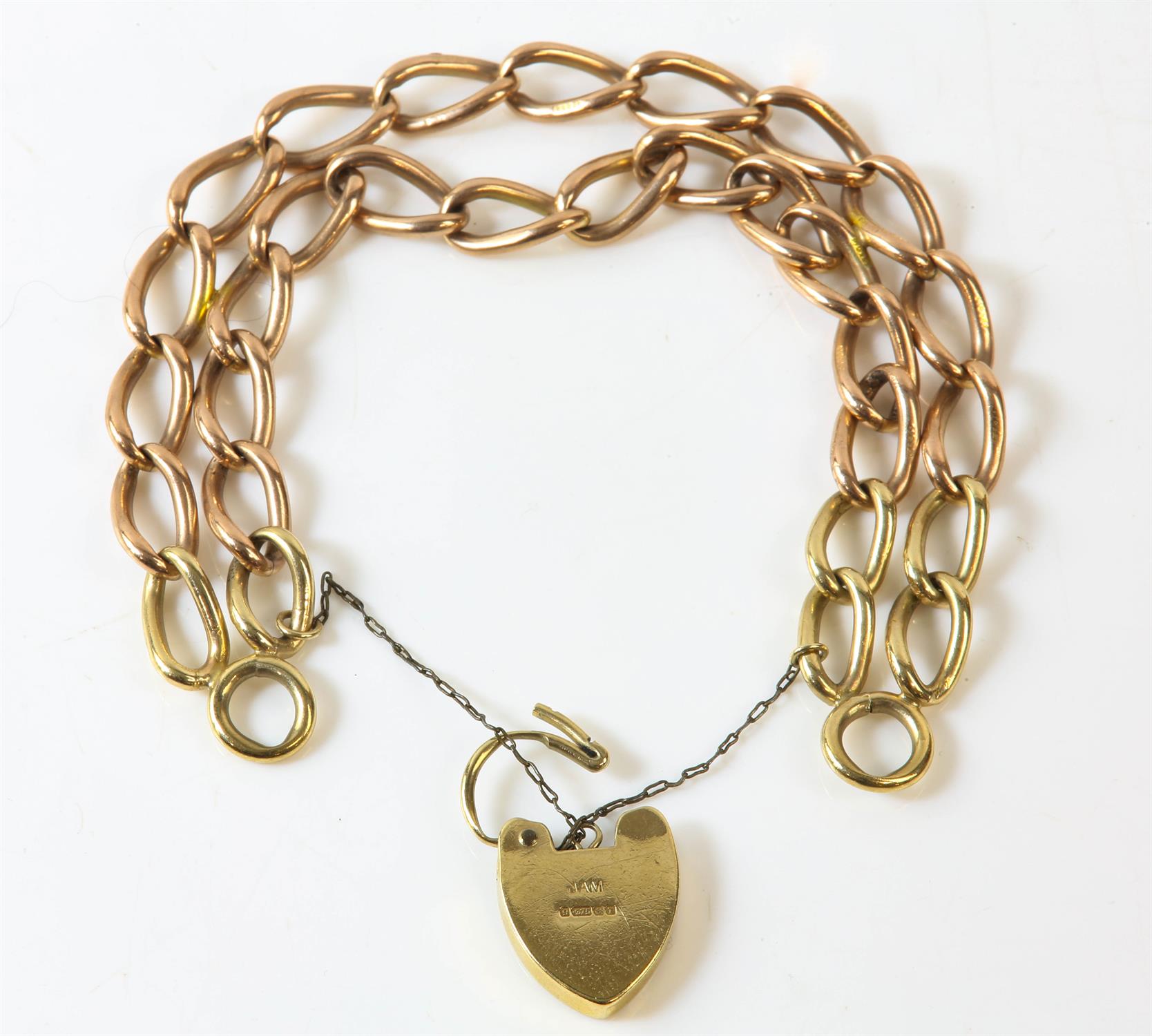 A double row link bracelet with a heart padlock clasp and safety chain, in 9ct yellow gold, - Image 2 of 2