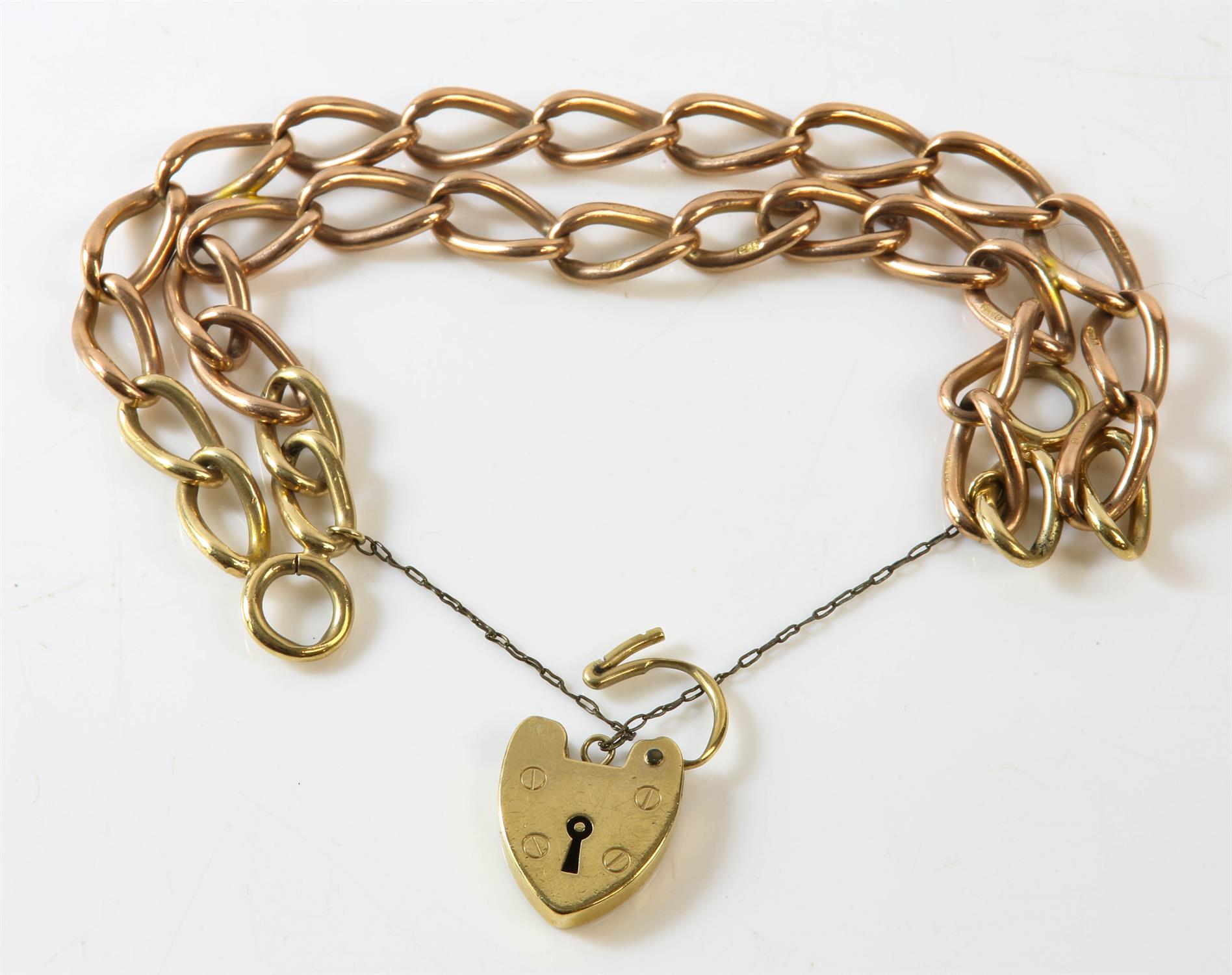 A double row link bracelet with a heart padlock clasp and safety chain, in 9ct yellow gold,