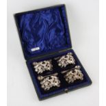 Victorian set of four pierced and embossed silver open salts by Robert Pringle & Sons,