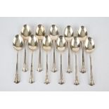 Part set of eleven Late Victorian dessert spoons with scroll ends, Mappin & Webb Ltd.