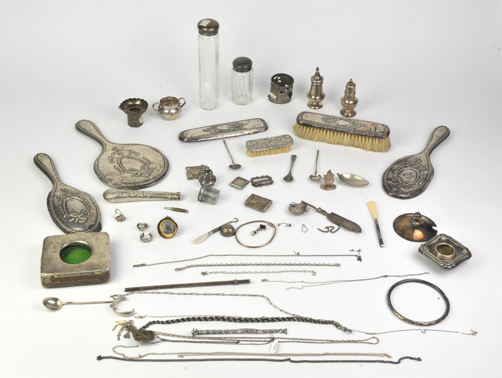 A collection of silver items to include brush backs, broken flatware, etc. Approx.36 troy oz.