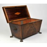19th century mahogany sarcophagus shaped tea caddy with lion mask ring handles on paw feet,