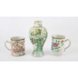 An elegant famille rose mug, decorated with Manchu/Chinese figures and river craft in a coastal
