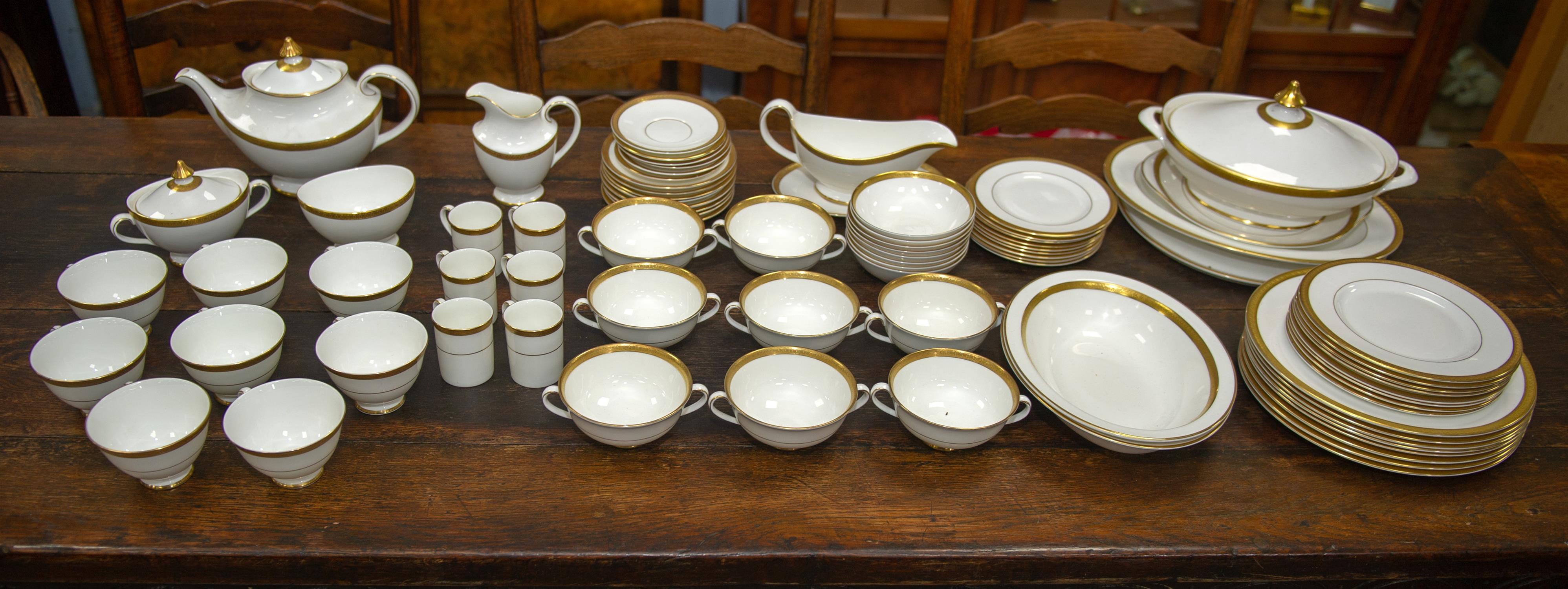 Royal Doulton Royal Gold part dinner and coffee service, printed marks to base, to comprise tea pot