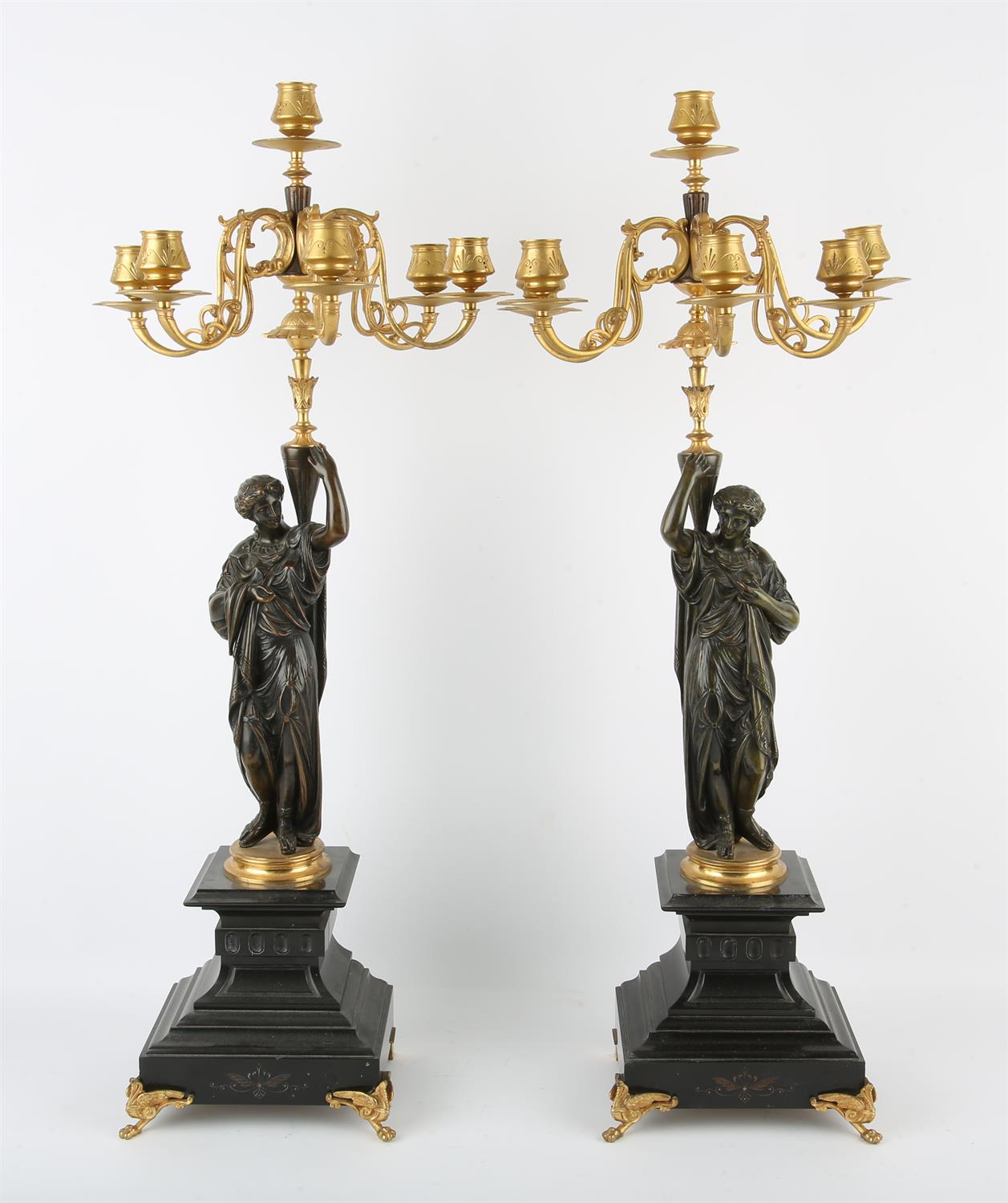 Pair of French bronze and gilt bronze six light candelabra, late 19th Century, in the form of two