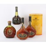 Four bottles of Cognacs and Armagnacs: Janneau Grand Armagnac VSOP, one in ton (2) Remy Martin