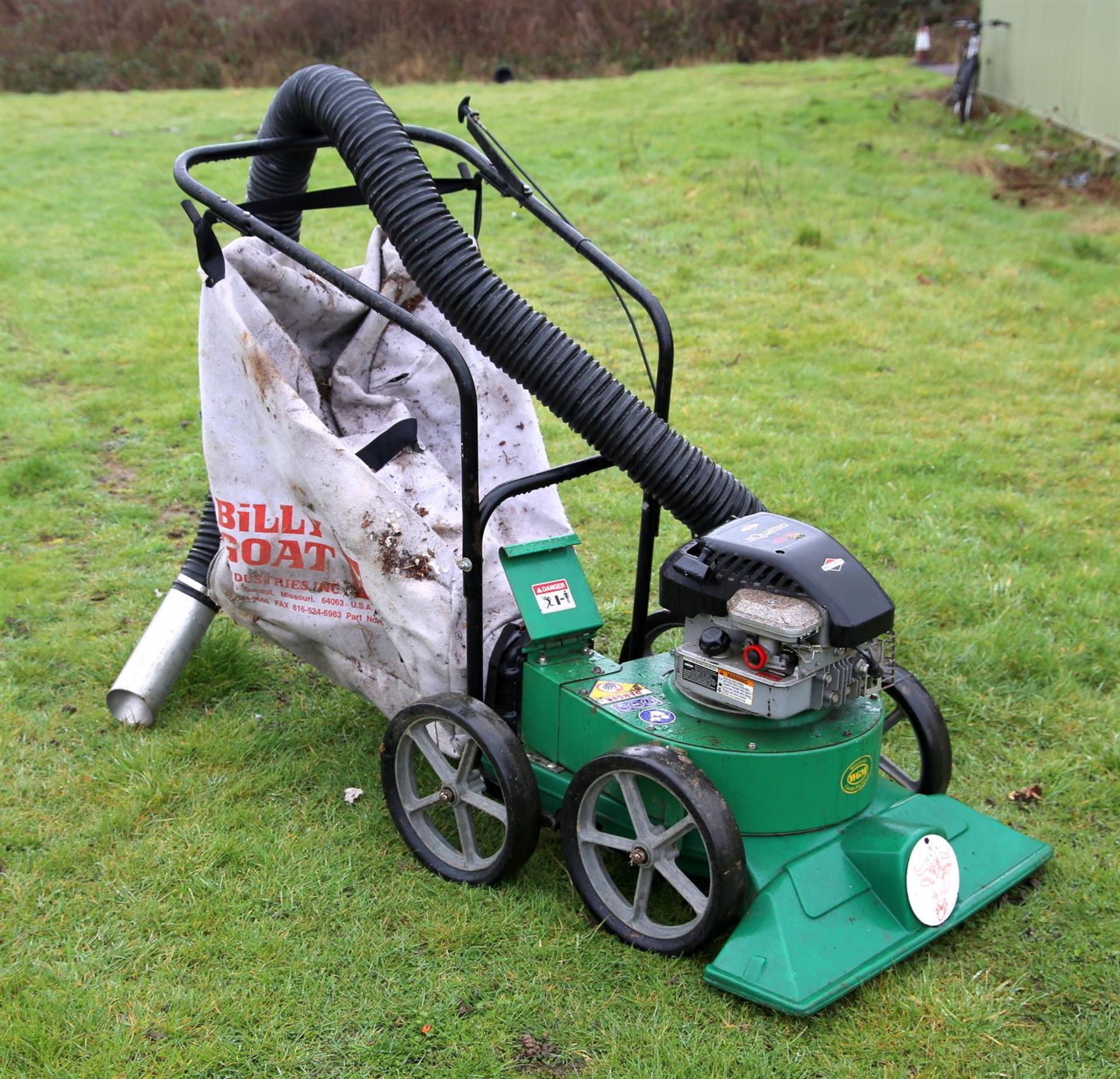A Quattro/Briggs and Stratton grass mower, together with a Billy goat Industries collection bag and