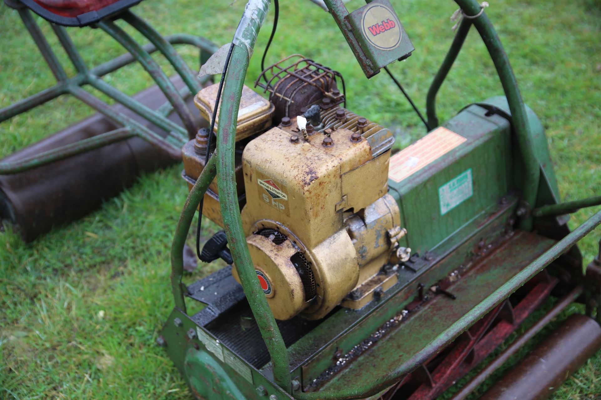 A Webb cylinder mower, green painted. With ride-on seat, the mower 100cm high x 73cm wide x 75cm - Image 2 of 3