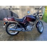 1987 Honda XBR 500 single cylinder motorbike in maroon colour. Registration E602 WGK, mileage 45,
