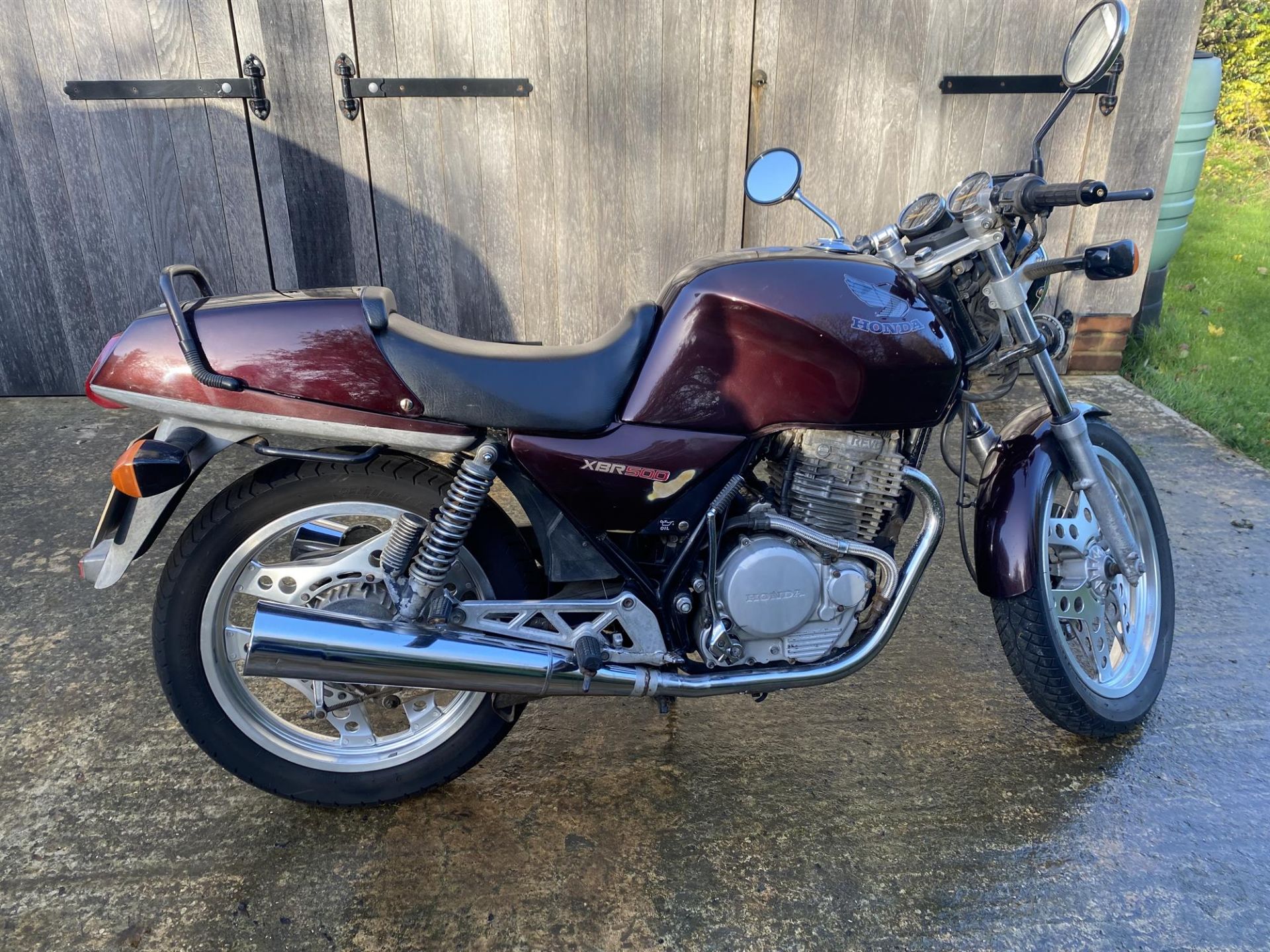 1987 Honda XBR 500 single cylinder motorbike in maroon colour. Registration E602 WGK, mileage 45,