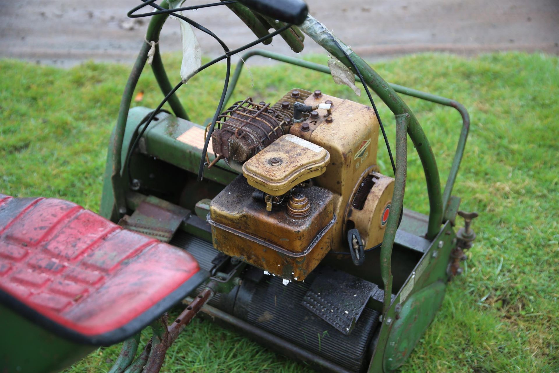 A Webb cylinder mower, green painted. With ride-on seat, the mower 100cm high x 73cm wide x 75cm - Image 3 of 3