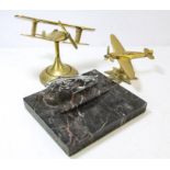 Jaguar chrome plated Mascot desk ornament, brass model of a Spitfire and a similar plane(3)