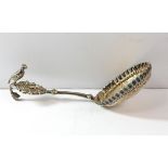 Victorian silver caddy or wine spoon, London 1897 with embossed decoration bowl and bird on handle.