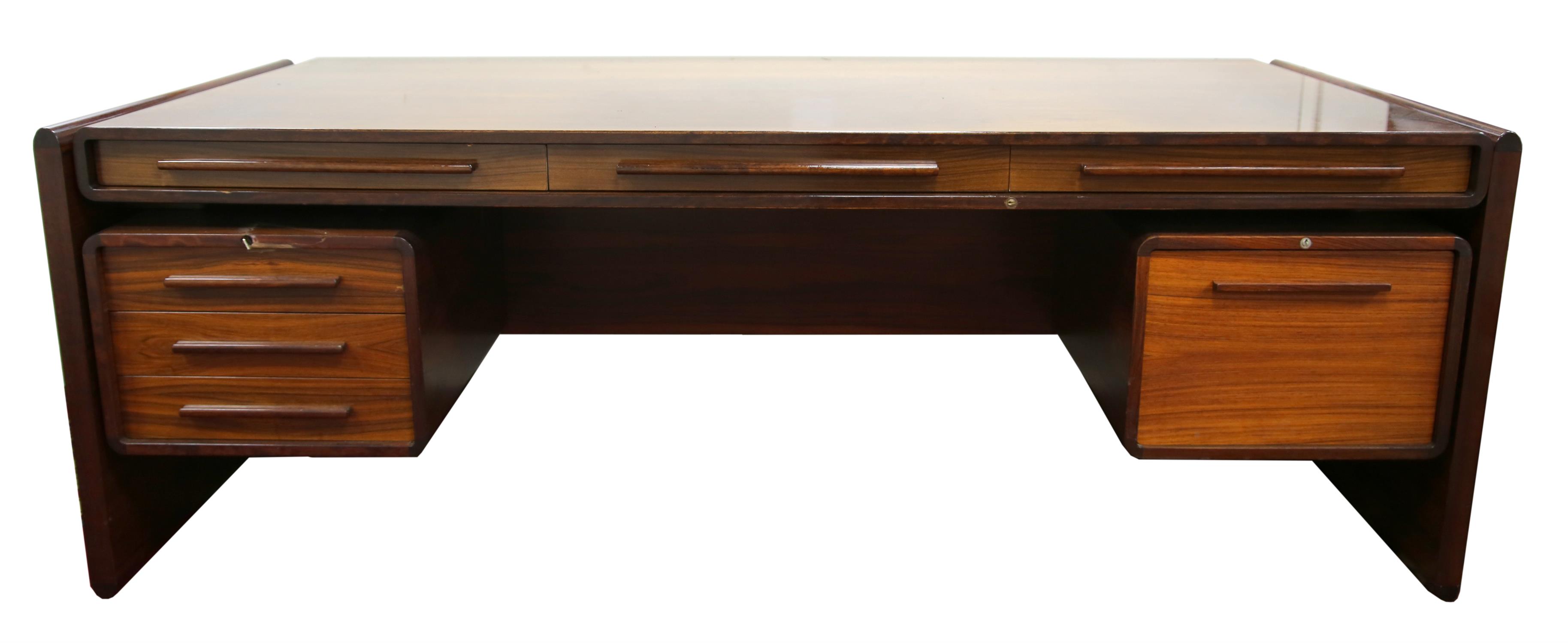 SVEND DYRLUND, a Stantos rosewood Executive desk, the rectangular top with three frieze drawers,