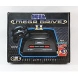 SEGA Mega Drive 2 - Sonic 2 Edition - New - Boxed and Unused. This lot contains a boxed Mega Drive