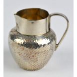 Sparrow beak design silver cream jug with hammered finish, Birmingham cir1917.